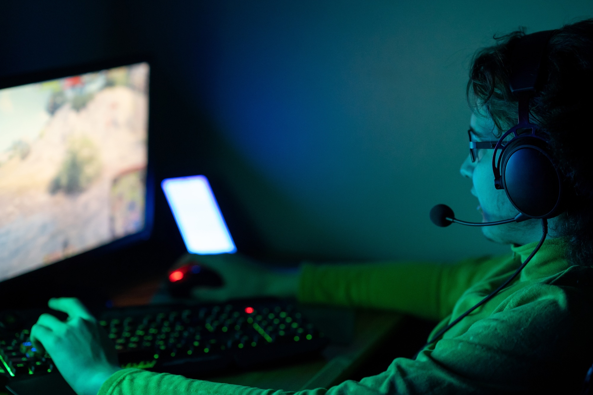 Gamer. Young man playing computer games